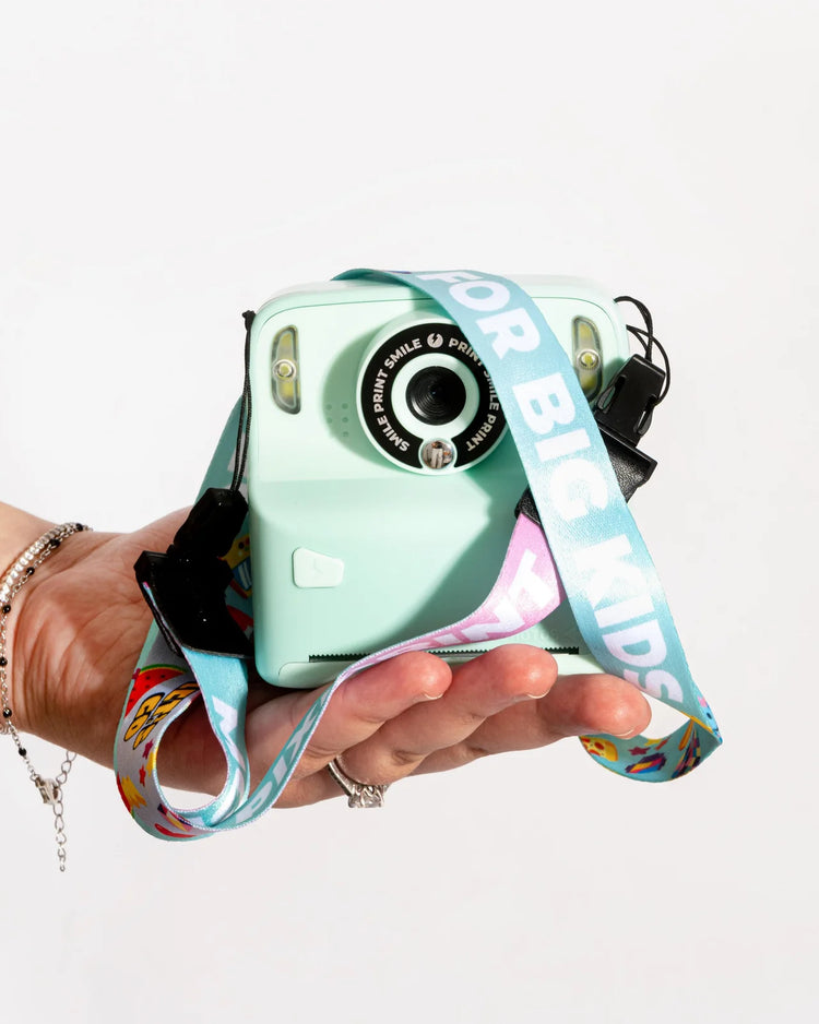 Appareil photo instantané avec sangle, vue de face
