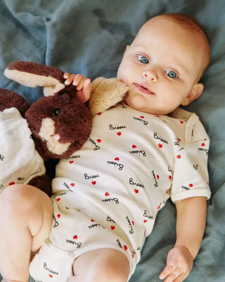 Body enfant doux avec broderie 'bisou' sur le devant.