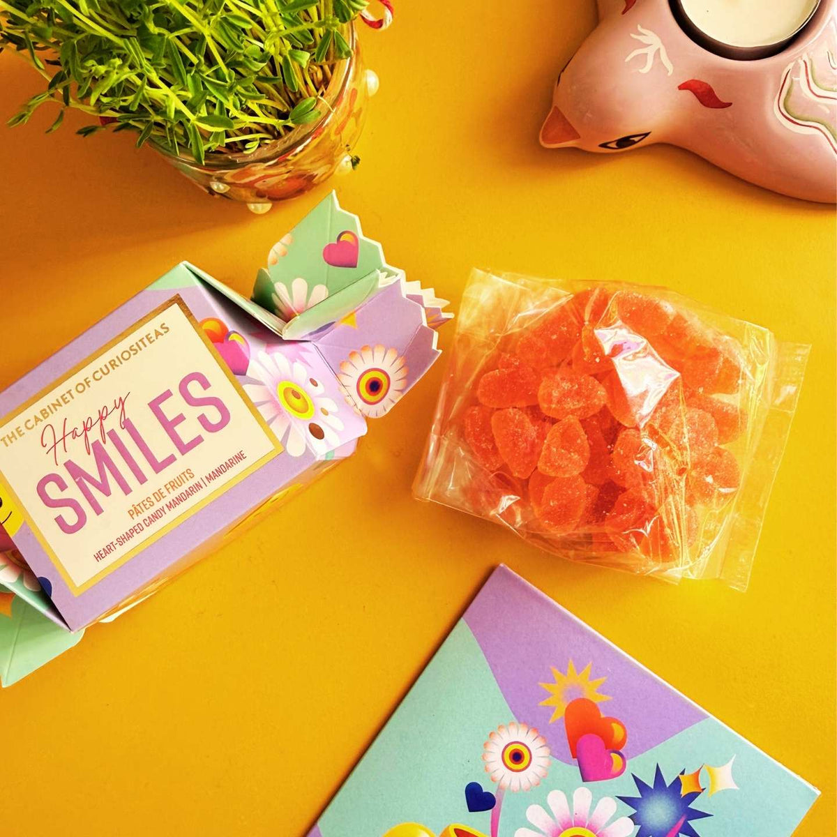 Papillote de bonbons Happy avec motif coloré et texture fruitée