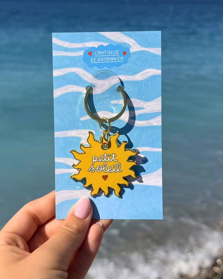 Porte-clés en forme de soleil avec message 'Petit Soleil