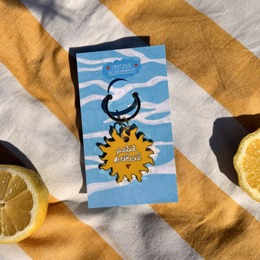 Porte-clés en forme de soleil avec message positif