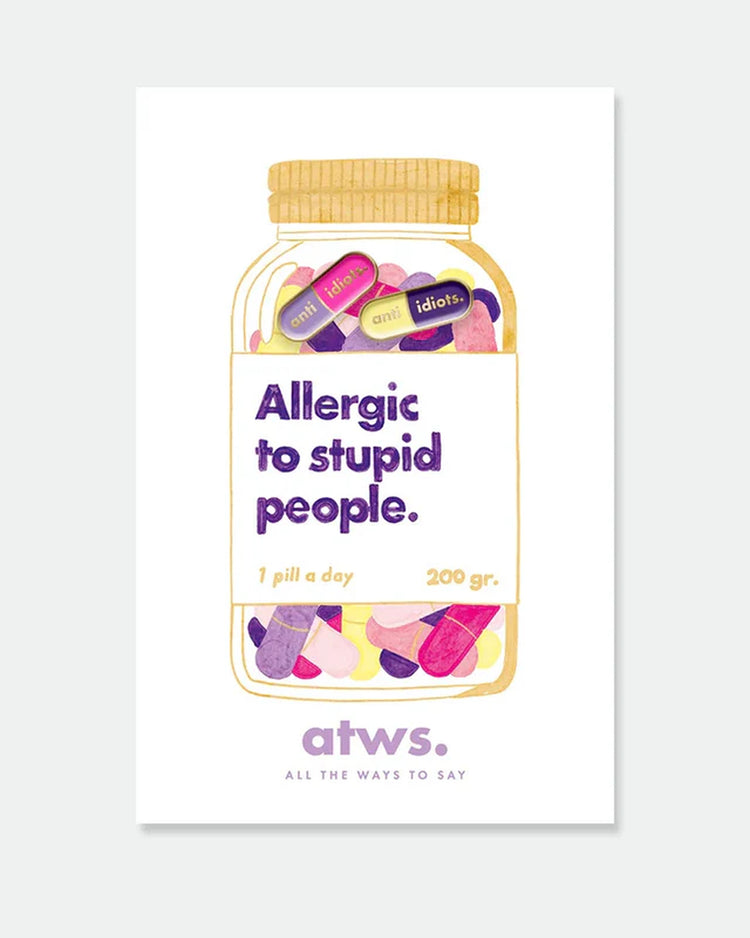 Pins en forme de capsule avec message humoristique anti-idiots