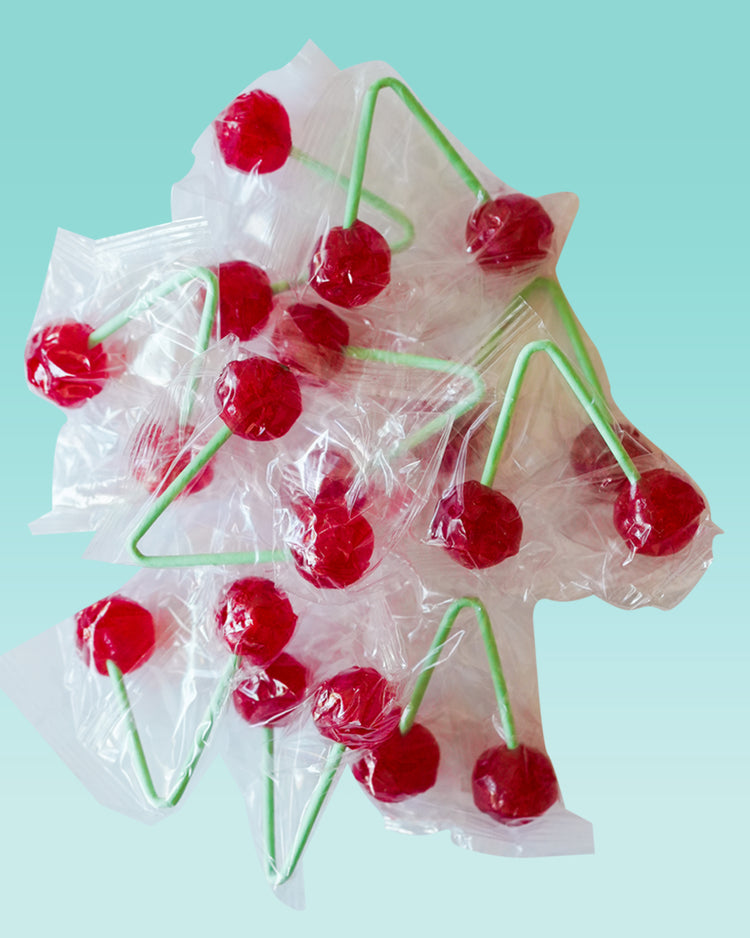 Sucette double cerise avec deux bonbons aux extrémités