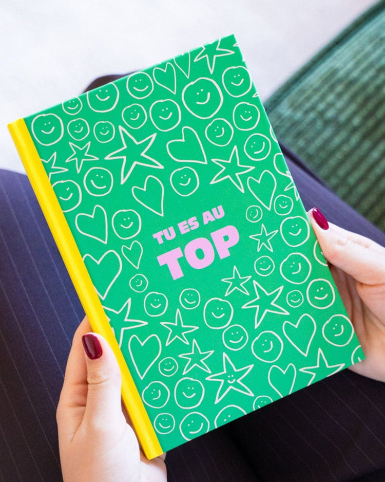 Carnet coloré avec message positif sur la couverture