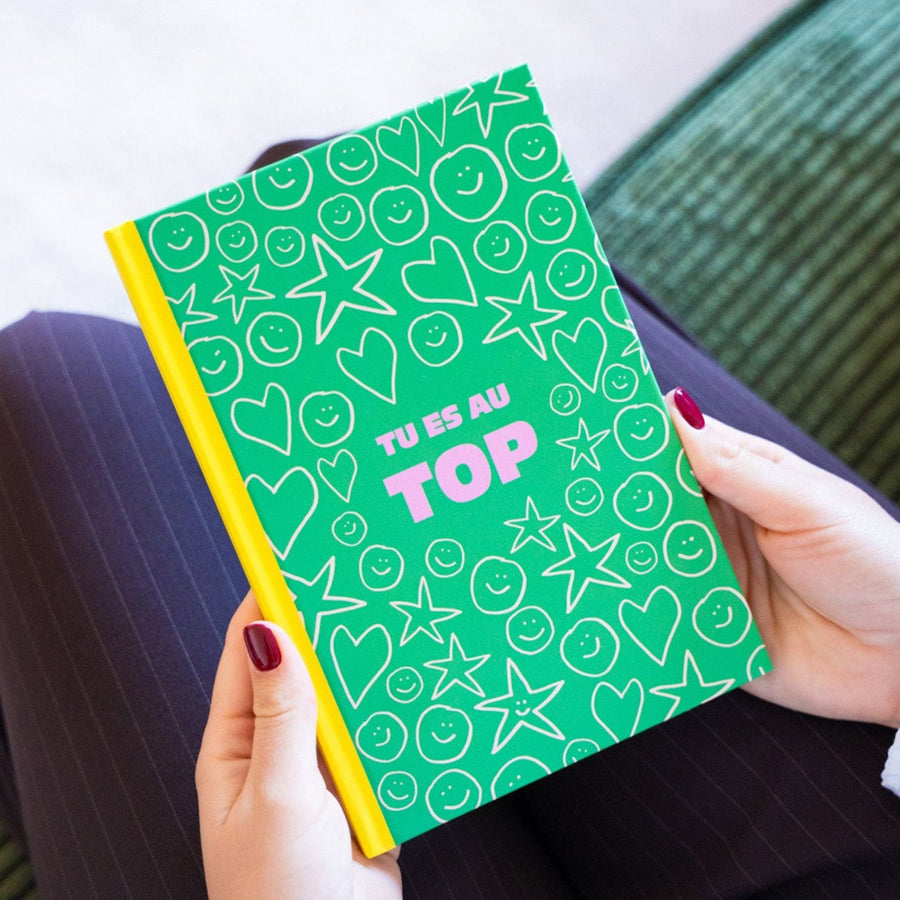 Carnet coloré avec message positif sur la couverture