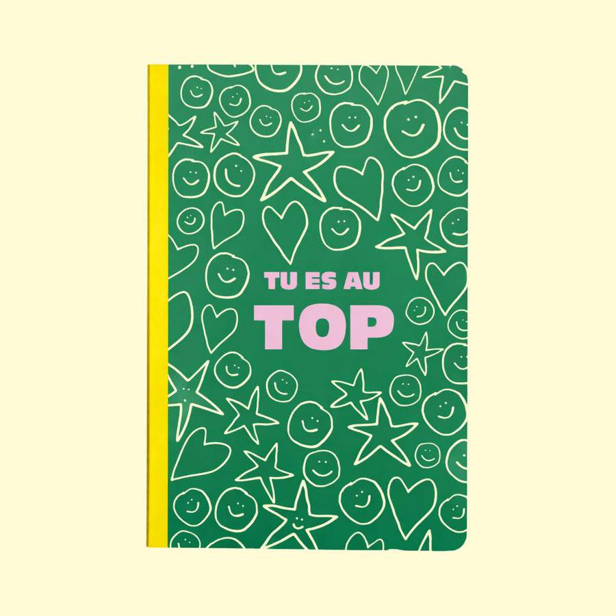Carnet coloré avec le message 'Tu es au top' en gros plan