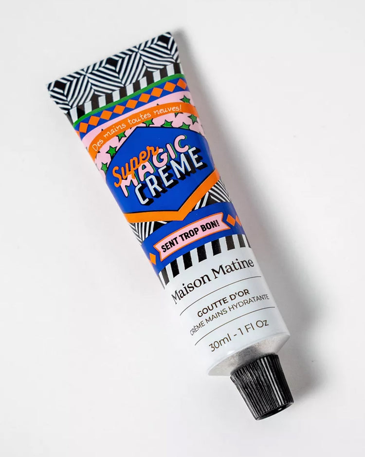 Crème mains Super Magic avec texture crémeuse et tube élégant.