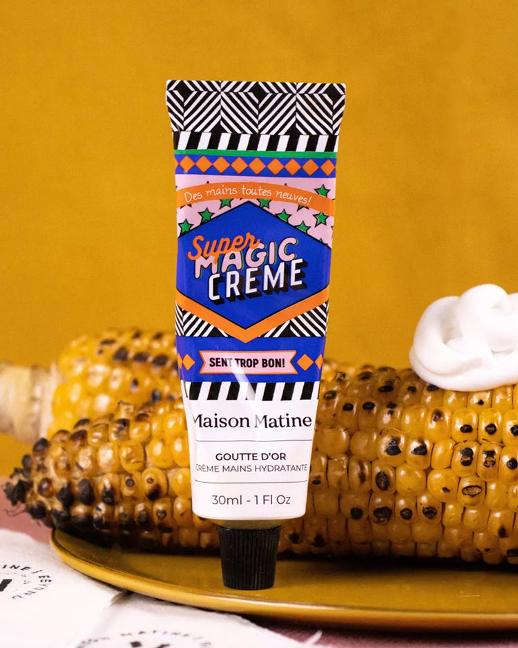 Crème mains Super Magic avec texture crémeuse et tube élégant.
