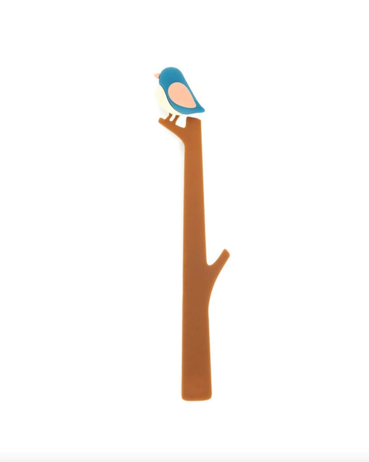 Marque-pages avec un oiseau coloré sur le coin d'un livre