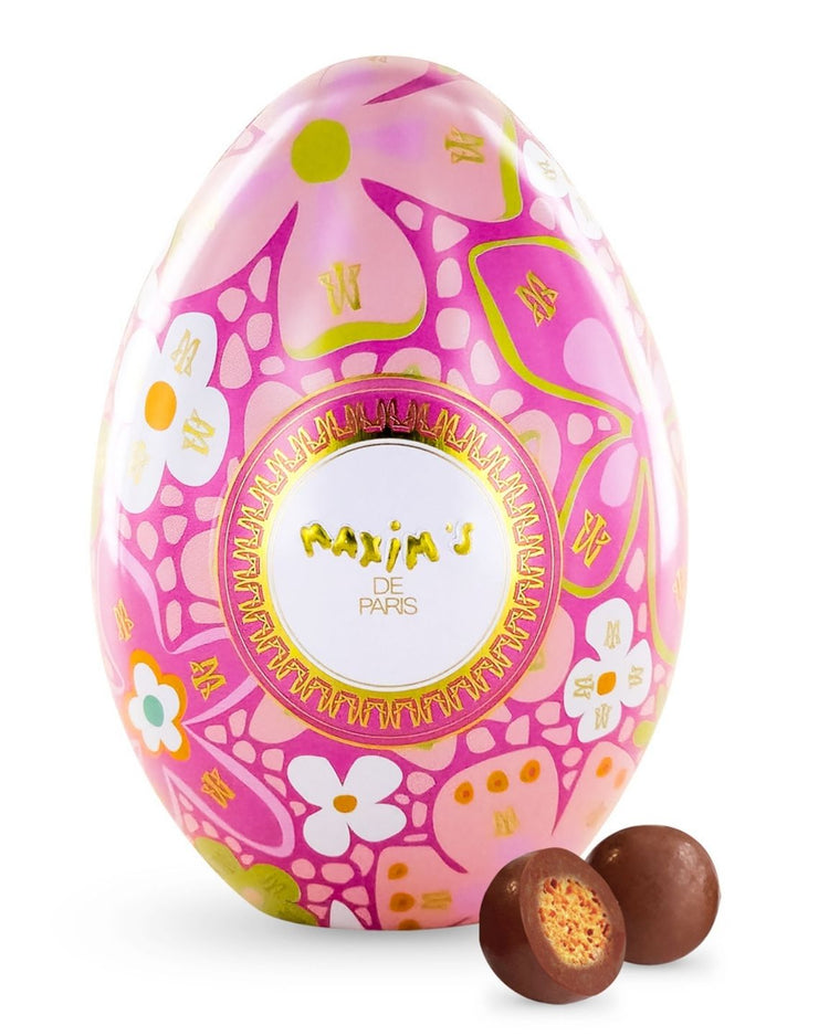 Oeuf Maxim's enrobé de chocolat au lait avec perles colorées