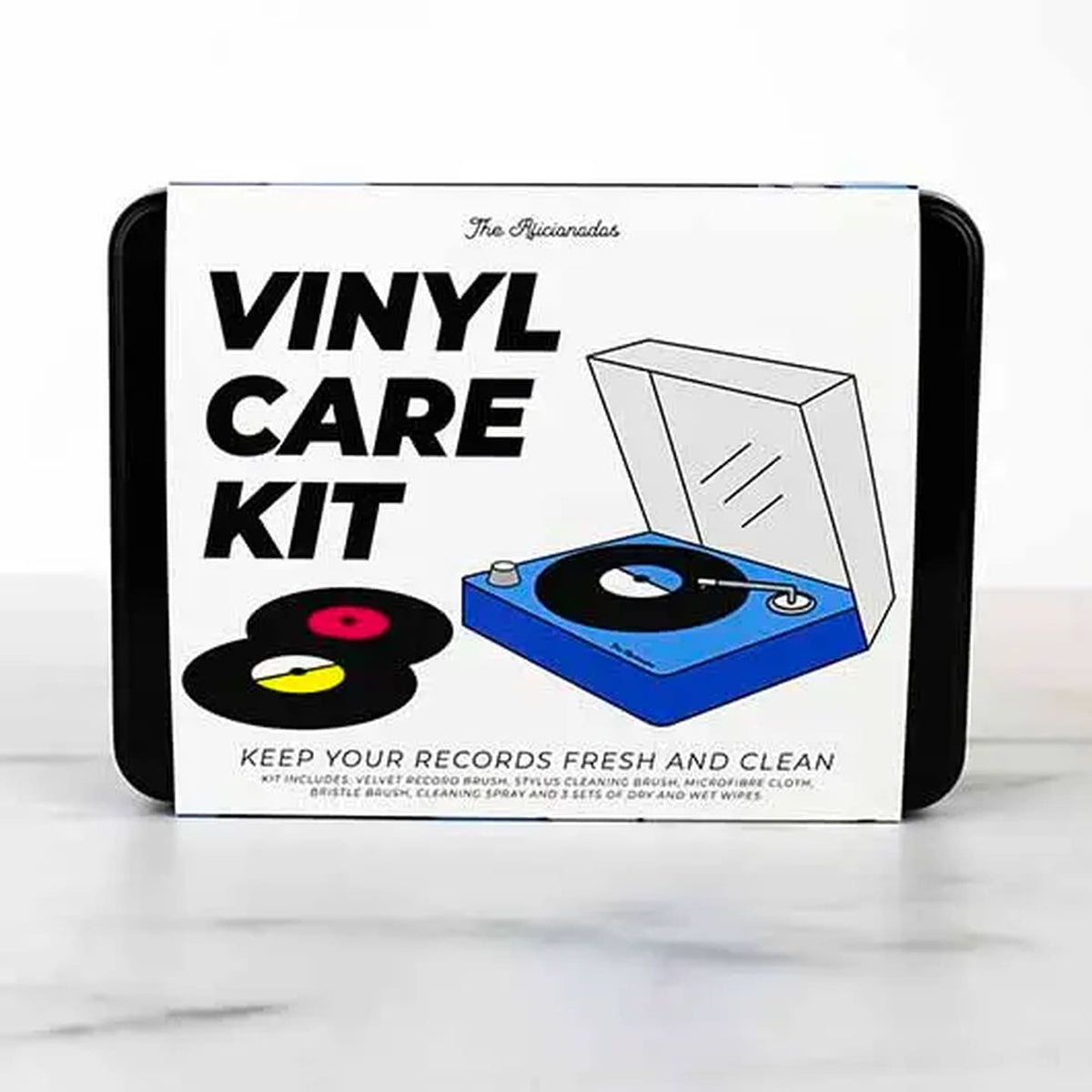 Kit de nettoyage vinyle avec brosse et solution, vue de dessus