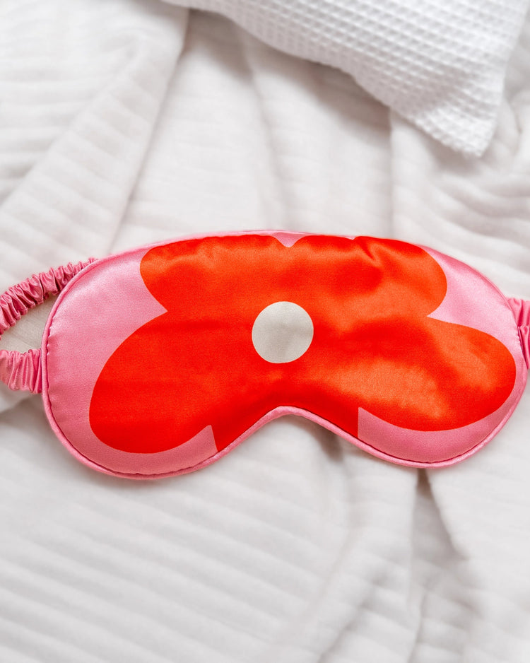 Masque de sommeil avec motif floral rose sur fond doux