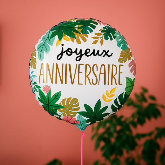 Ballon d'anniversaire tropical avec motifs de feuilles vertes.