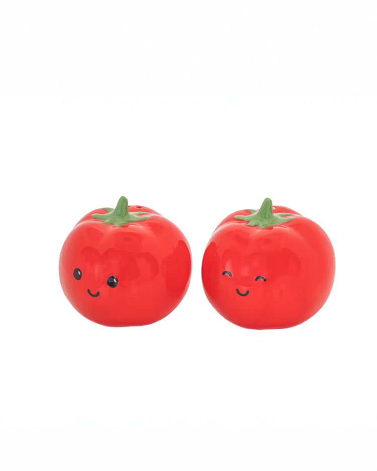 Salière et poivrière en forme de tomate, vue de côté.