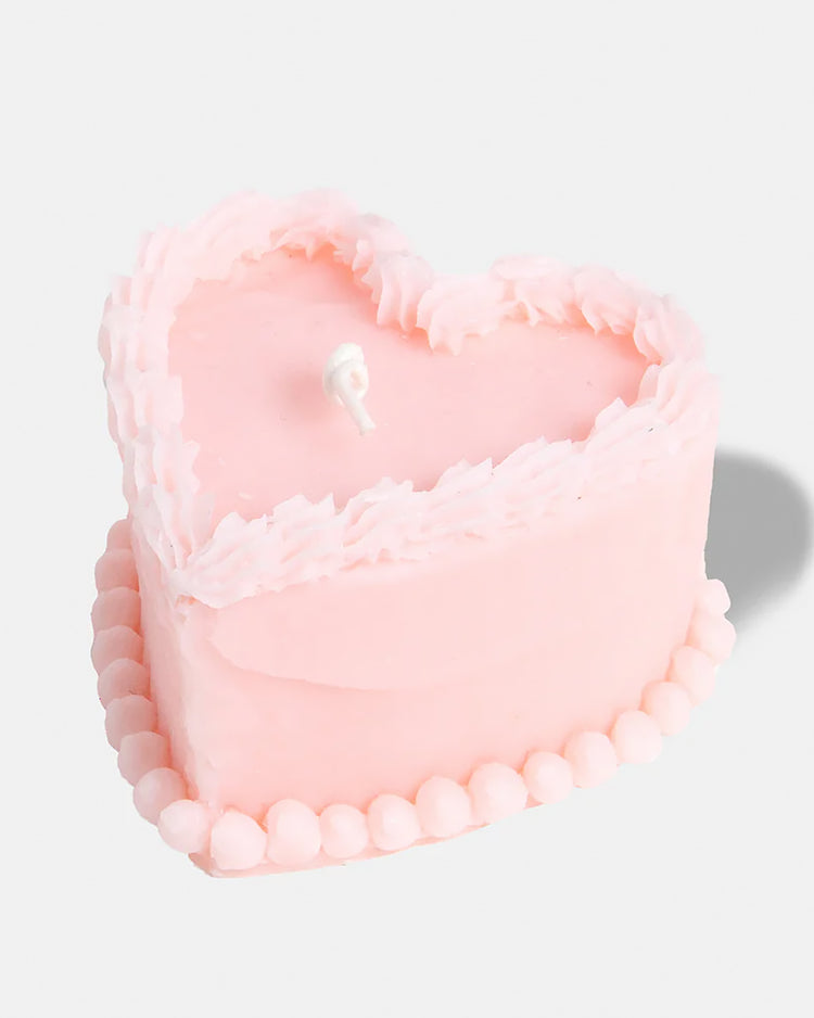 Bougie rose en forme de gâteau avec détails réalistes