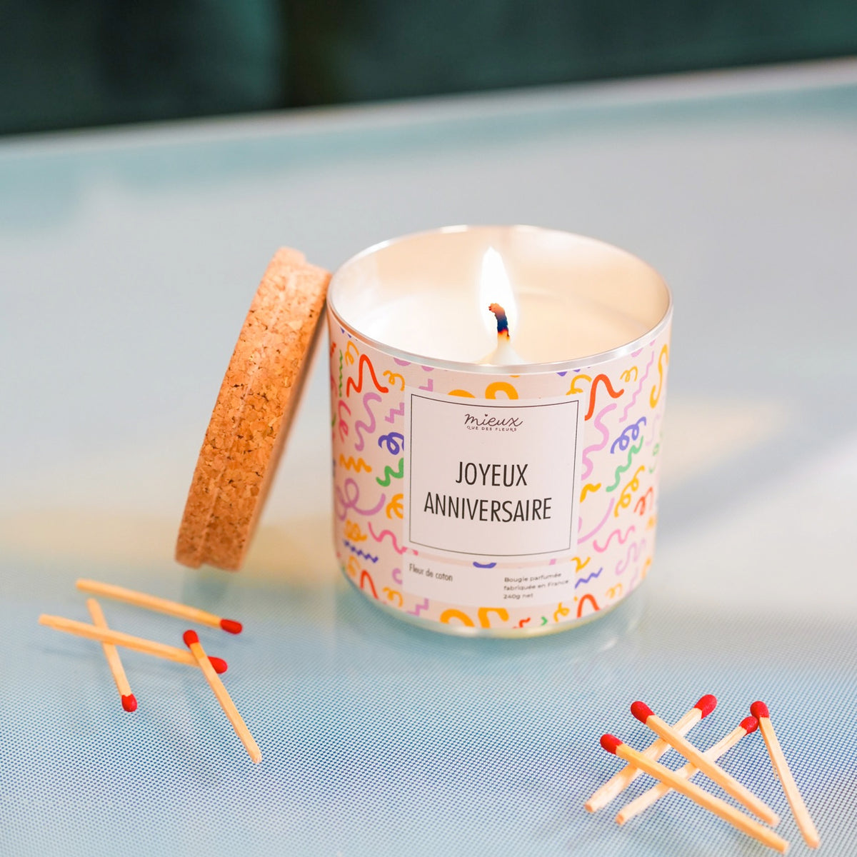 Bougie à message avec motif floral sur le verre