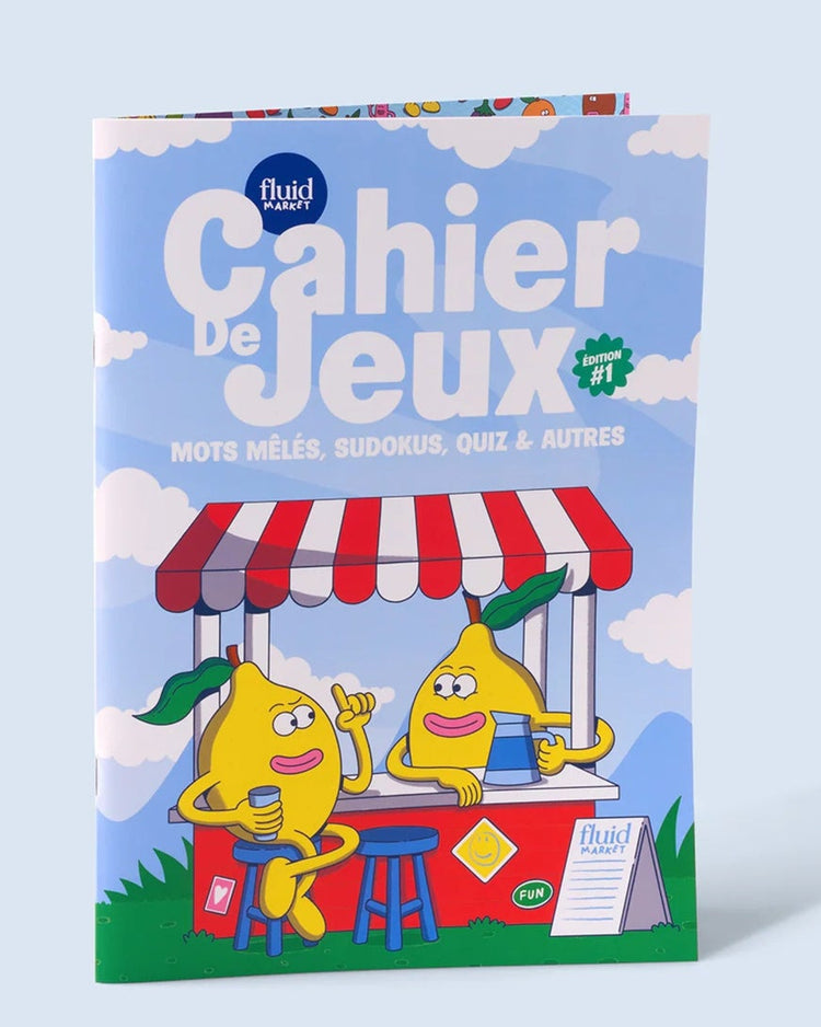 Cahier de jeux ouvert montrant des pages remplies de défis variés