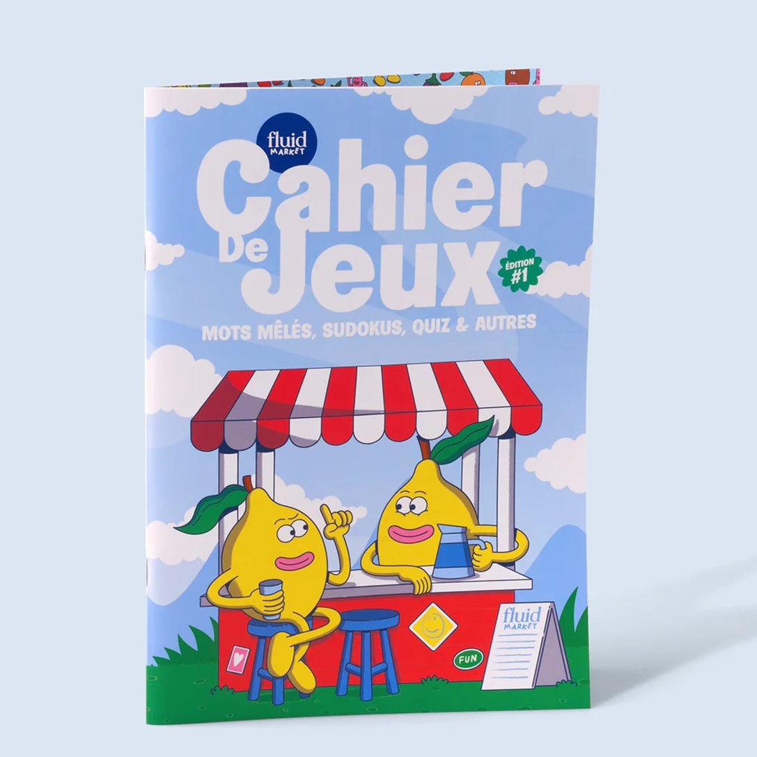 Cahier de jeux ouvert montrant des pages remplies de défis variés