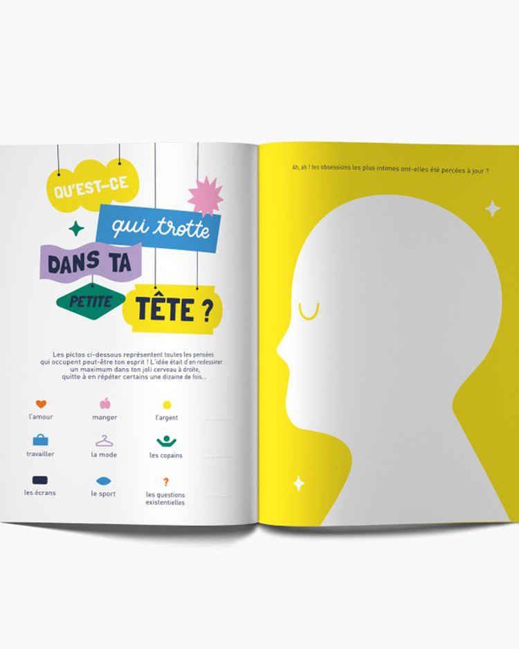 Carnet 'Vive toi !' ouvert, pages blanches avec illustrations humoristiques.