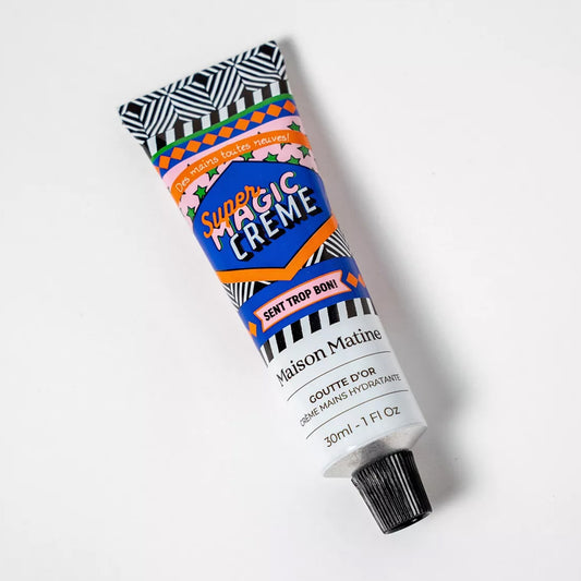 Crème mains Super Magic avec texture crémeuse et tube élégant.