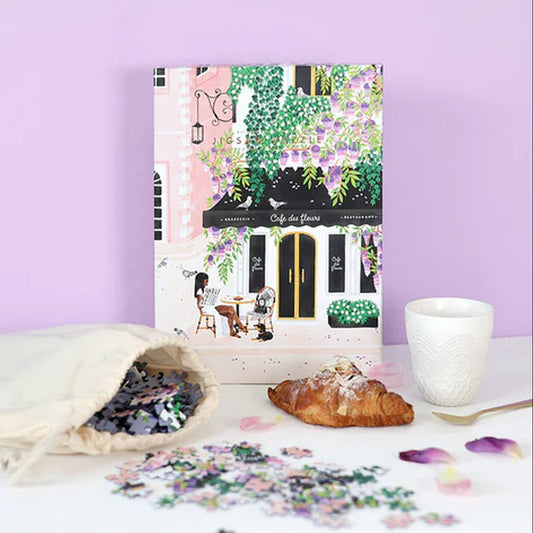 Puzzle représentant un café parisien avec des détails colorés