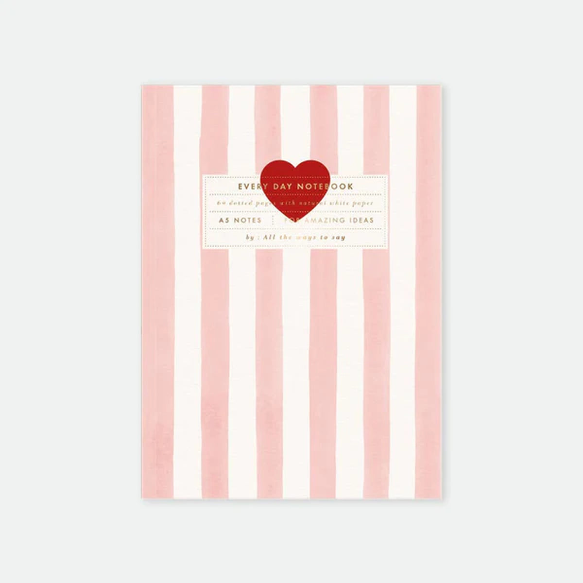 Carnet rayé rose avec cœur rouge sur la couverture